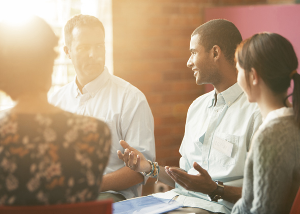 Man speaking in group therapy session